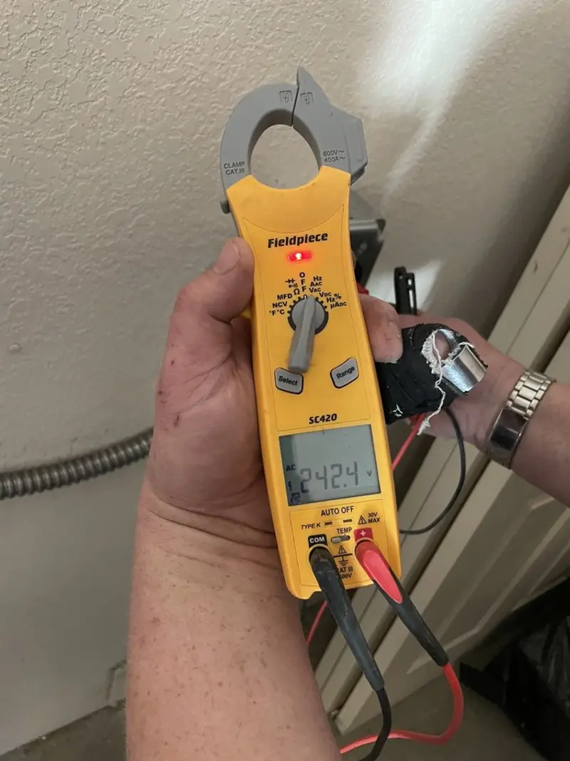 Voltage testing with clamp meter during Ceiling Fan Installation in Dudley